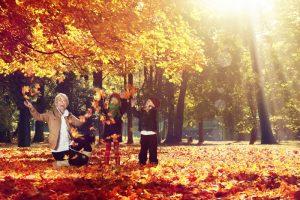 fall-plying-in-leaves-cold-weather